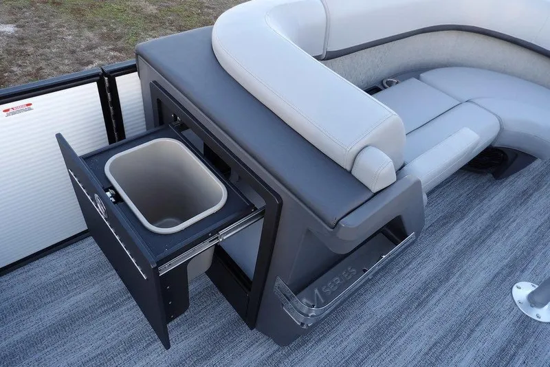 Slide: The Image of 2026 Bennington M Swingback 22 MSB boat interior with seating and built-in storage compartment. - 19