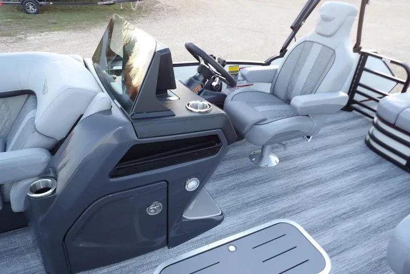 Slide: The Image of 2026 Bennington M Swingback 22 MSB boat interior with modern helm and seating. - 20