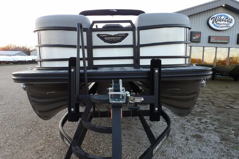Slide: The Image of 2026 Bennington M Swingback 22 MSB pontoon boat on trailer at marine center. - 3