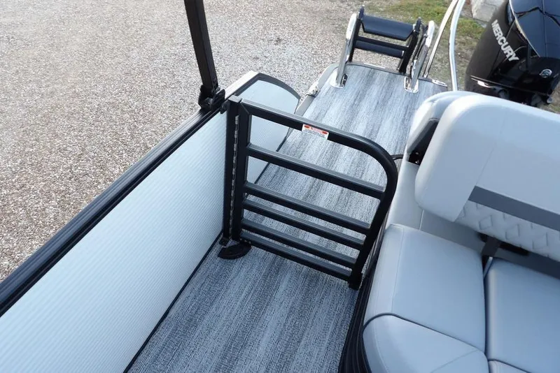 Slide: The Image of 2026 Bennington M Swingback 22 MSB boat interior with seating and safety gate. - 34