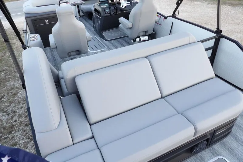 Slide: The Image of 2026 Bennington M Swingback 22 MSB interior with gray seating and modern helm controls. - 36