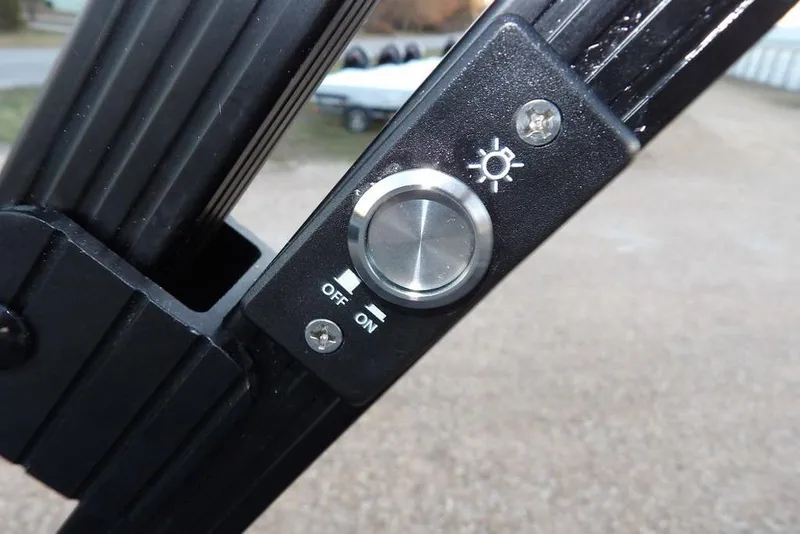 Slide: The Image of Close-up of a light switch on a 2026 Bennington M Swingback 22 MSB boat. - 38