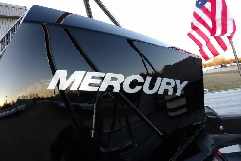 Slide: The Image of Mercury engine on 2026 Bennington M Swingback 22 MSB with American flag in background. - 41