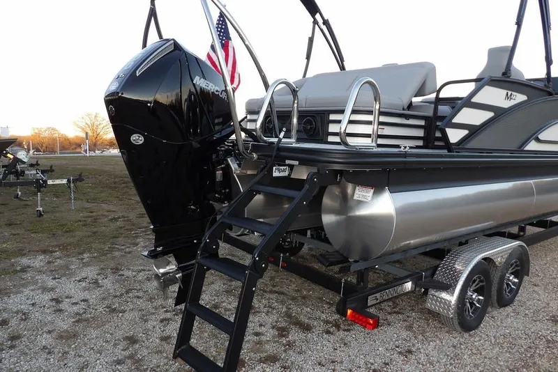 Slide: The Image of 2026 Bennington M Swingback 22 MSB pontoon boat with Mercury engine and trailer. - 42