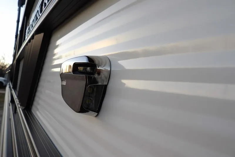 Slide: The Image of 2026 Bennington M Swingback 22 MSB exterior detail with sleek design and modern lighting. - 48