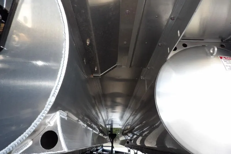 Slide: The Image of Underneath view of 2026 Bennington M Swingback 22 MSB pontoon boat, showcasing metal structure. - 51