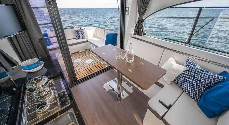 Slide: The Image of Interior of 2026 Beneteau Antares 11 yacht with elegant seating and ocean view. - 12