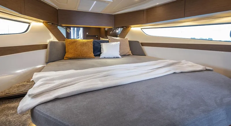 Slide: The Image of Luxurious cabin interior of 2026 Beneteau Antares 11 with cozy bedding and modern design. - 14