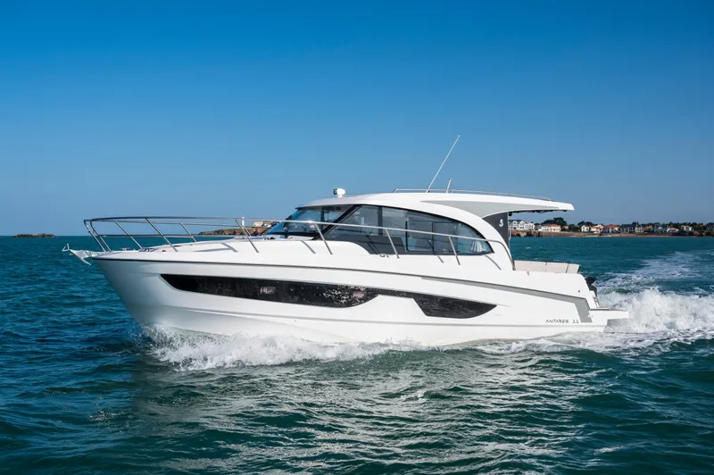 Slide: The Image of 2026 Beneteau Antares 11 cruising on open water under clear blue sky. - 3
