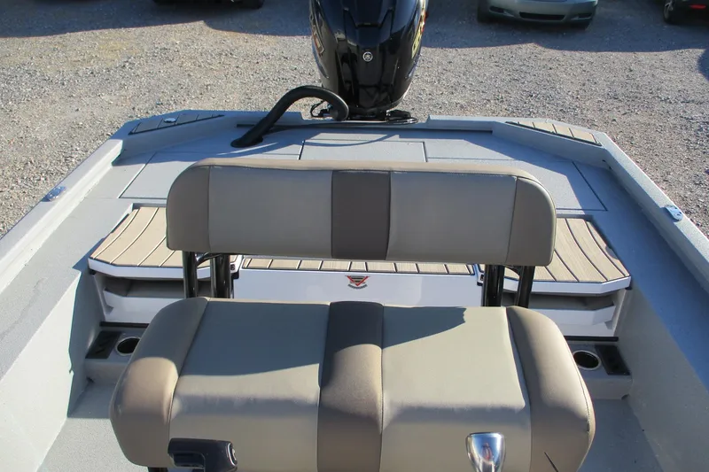 Slide: The Image of 2026 Vexus ACX2210 boat interior with beige seating and motor. - 10