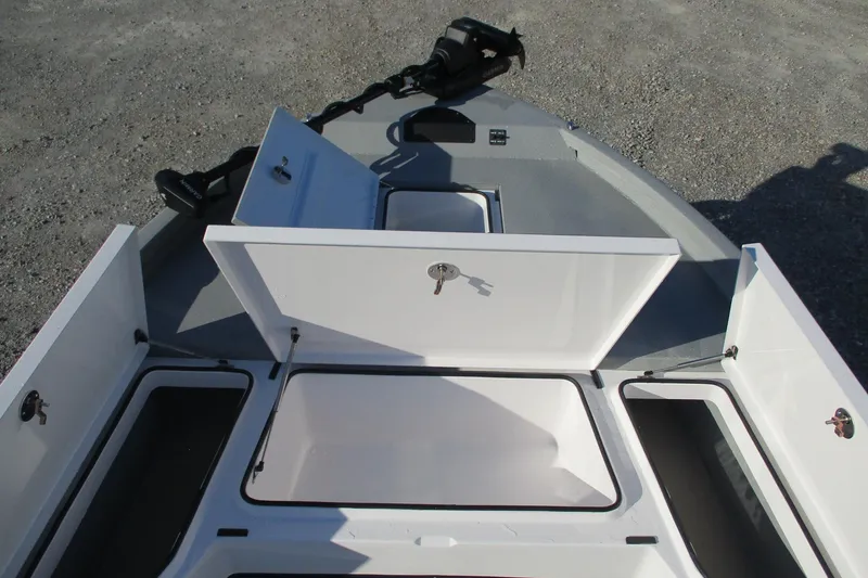 Slide: The Image of 2026 Vexus ACX2210 boat storage compartments open, showcasing spacious interior design. - 11