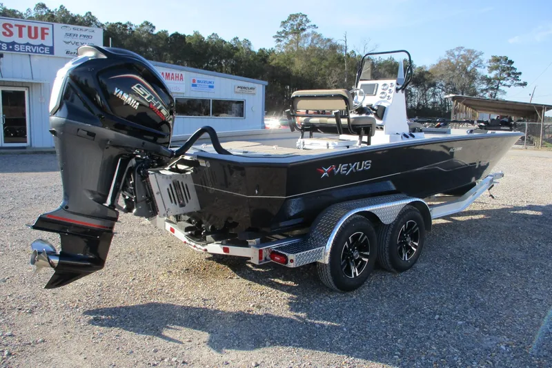 Slide: The Image of 2026 Vexus ACX2210 boat with Yamaha engine on a trailer, parked outdoors. - 6