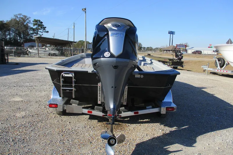 Slide: The Image of 2026 Vexus ACX2210 boat on trailer, rear view with powerful outboard motor. - 7