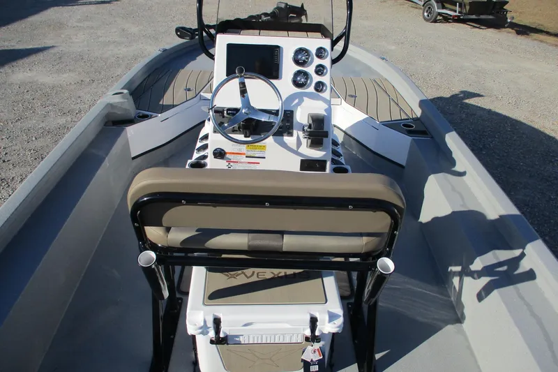 Slide: The Image of 2026 Vexus ACX2210 boat interior with steering console and seating. - 8