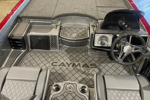 Slide: The Image of 2026 Caymas CX 21 PRO boat interior with steering wheel and seating. - 4
