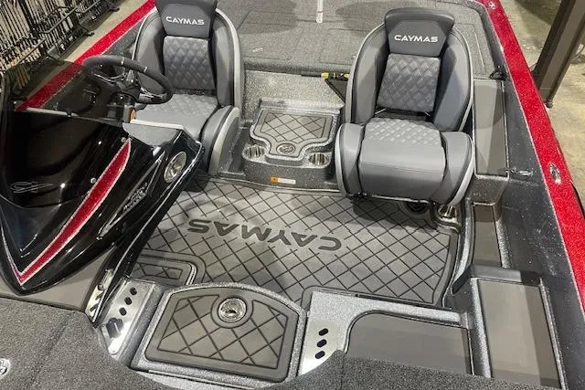 Slide: The Image of 2026 Caymas CX 21 PRO boat interior with dual seats and steering console. - 5