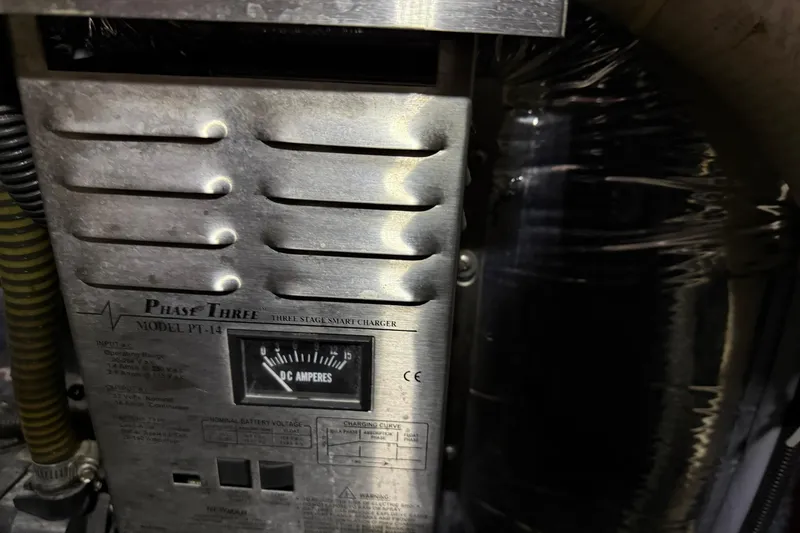 Slide: The Image of Close-up of a Phase Three PT-14 smart charger in a 1995 Carver 250 Express. - 31