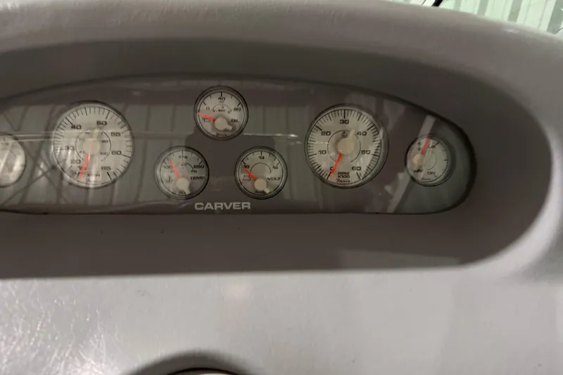 Slide: The Image of Dashboard of a 1995 Carver 250 Express boat with various gauges. - 5