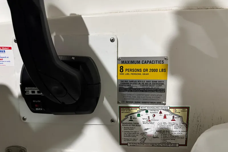 Slide: The Image of 1995 Carver 250 Express boat capacity label and control lever, maximum 8 persons or 2000 lbs. - 17
