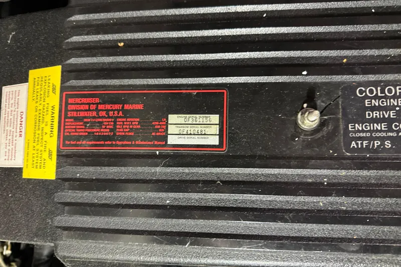 Slide: The Image of Close-up of a 1995 Carver 250 Express engine label with specifications and warnings. - 29