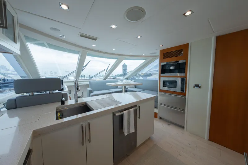 Slide: The Image of Luxurious 2012 Lazzara Breeze yacht interior with modern kitchen and panoramic windows. - 10