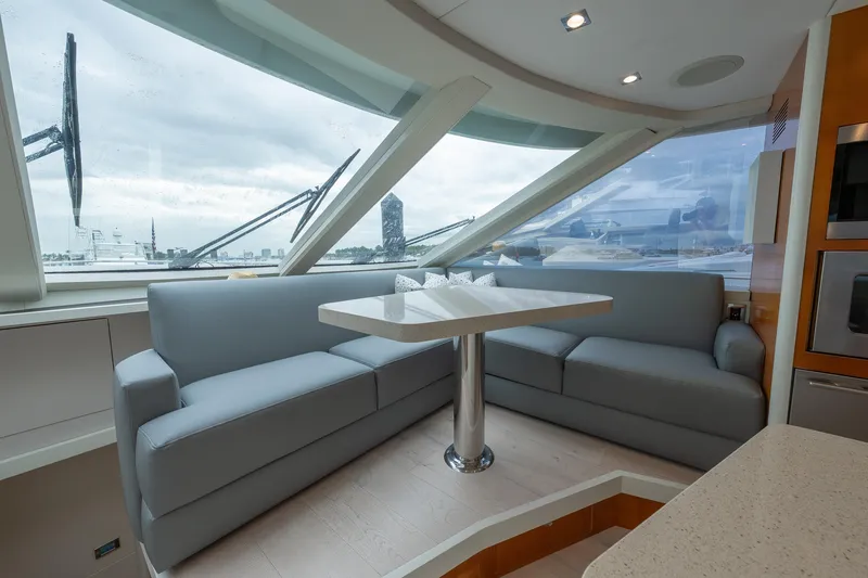 Slide: The Image of Luxurious interior of 2012 Lazzara Breeze yacht with modern seating and panoramic windows. - 11