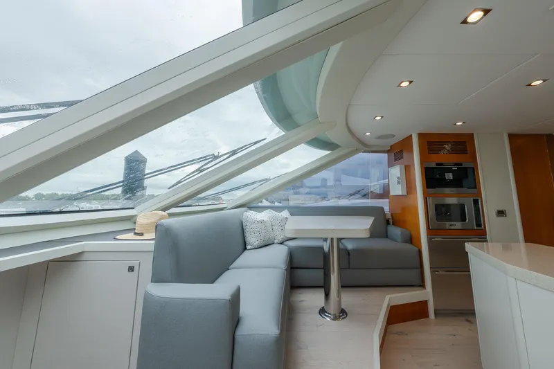 Slide: The Image of Luxurious interior of 2012 Lazzara Breeze yacht with modern seating and panoramic windows. - 12