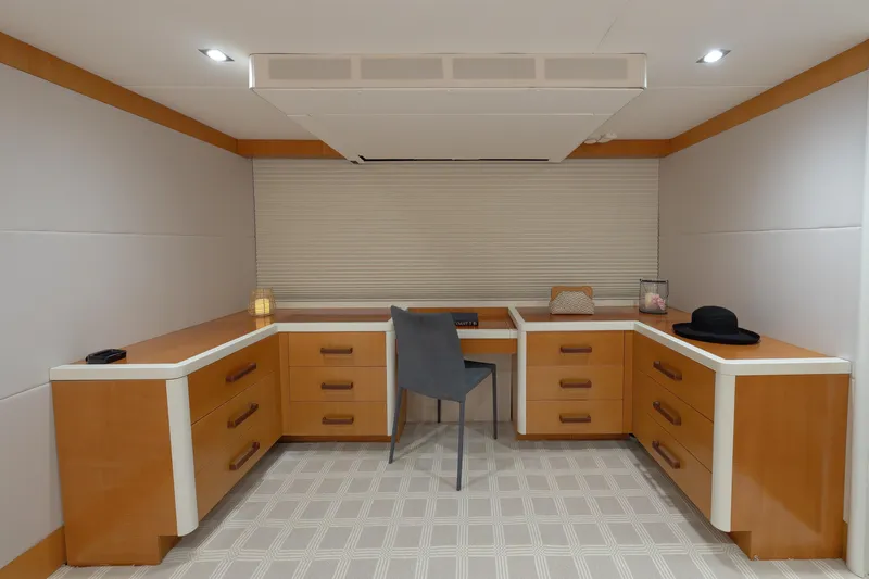 Slide: The Image of Luxurious 2012 Lazzara Breeze yacht interior with modern wooden cabinetry and elegant decor. - 17