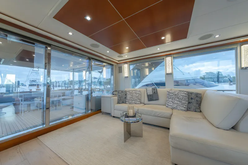 Slide: The Image of Luxurious interior of 2012 Lazzara Breeze yacht with modern decor and large windows. - 2