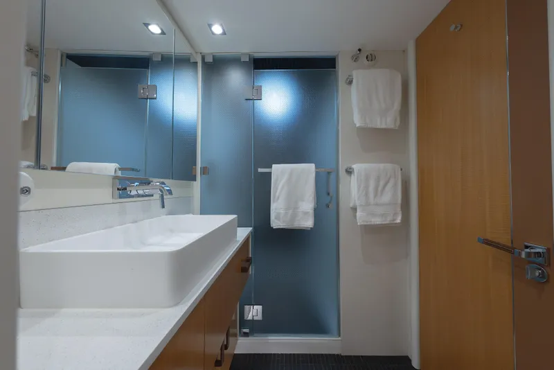 Slide: The Image of Modern bathroom in 2012 Lazzara Breeze yacht with sleek sink and frosted glass shower. - 20