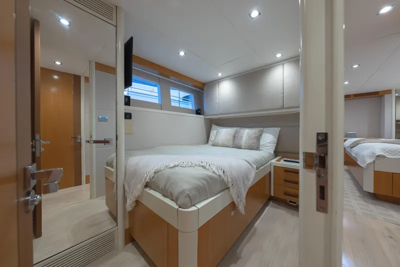 Slide: The Image of Luxurious 2012 Lazzara Breeze yacht bedroom with modern design and cozy bedding. - 24