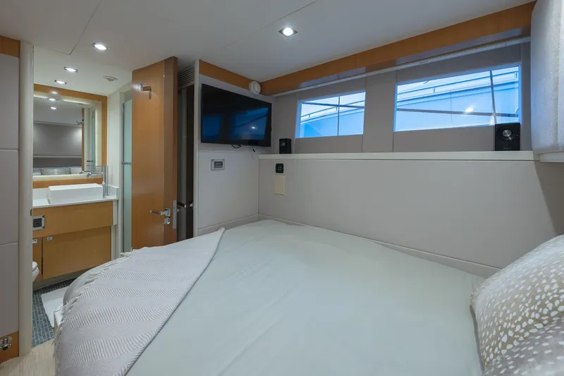 Slide: The Image of Luxurious 2012 Lazzara Breeze yacht bedroom with modern decor and ensuite bathroom. - 25