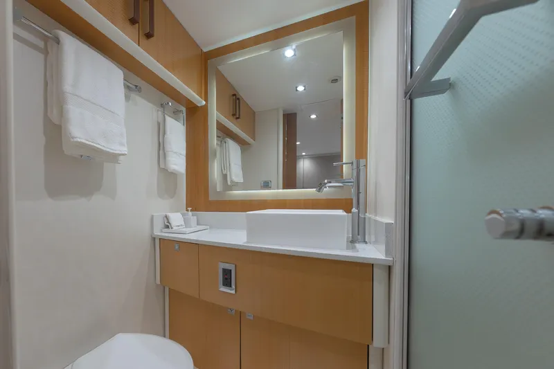 Slide: The Image of Luxurious bathroom in 2012 Lazzara Breeze yacht with modern fixtures and elegant design. - 26