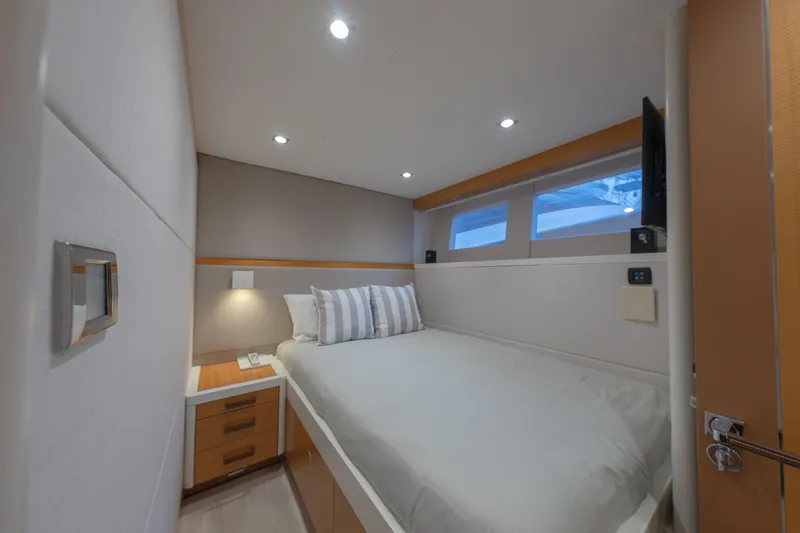 Slide: The Image of Luxurious cabin interior of 2012 Lazzara Breeze yacht with modern design and cozy bedding. - 27