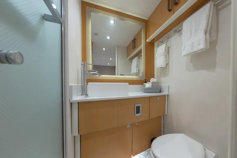 Slide: The Image of Luxurious bathroom in 2012 Lazzara Breeze yacht with modern fixtures and elegant design. - 28