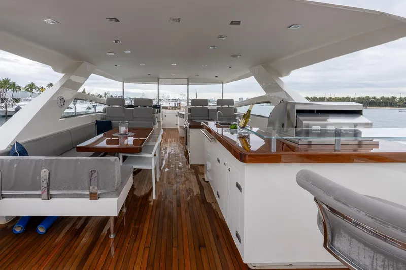 Slide: The Image of Luxurious 2012 Lazzara Breeze yacht deck with seating, dining area, and grill. - 29