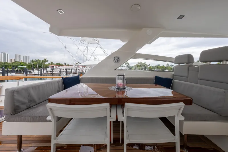 Slide: The Image of Luxurious 2012 Lazzara Breeze yacht deck with elegant seating and dining area. - 31