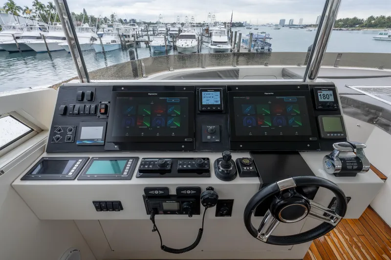 Slide: The Image of Control panel of a 2012 Lazzara Breeze yacht with advanced navigation systems. - 36
