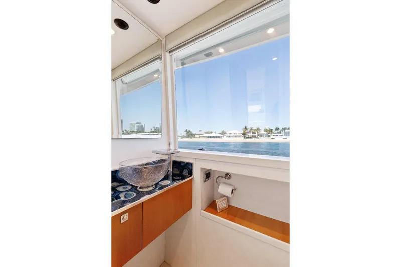 Slide: The Image of Luxurious 2012 Lazzara Breeze yacht bathroom with ocean view and elegant glass sink. - 4