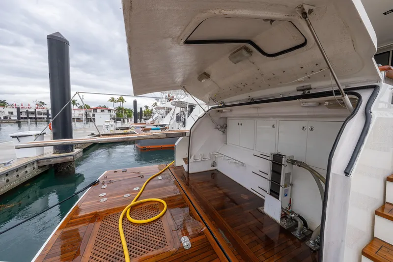 Slide: The Image of 2012 Lazzara Breeze yacht with open engine compartment at marina dock. - 45