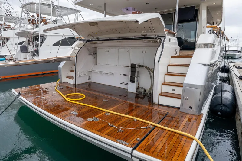 Slide: The Image of 2012 Lazzara Breeze yacht with open deck, docked at marina. - 46