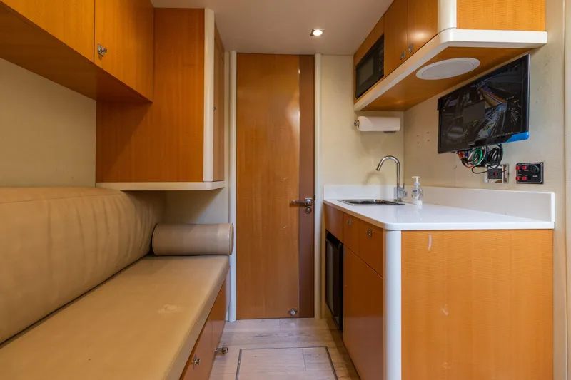 Slide: The Image of Interior of 2012 Lazzara Breeze yacht with modern kitchenette and seating area. - 51