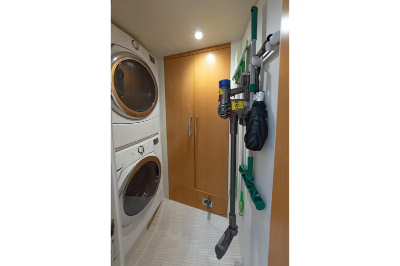 Slide: The Image of Laundry room in 2012 Lazzara Breeze yacht with stacked washer and dryer. - 53