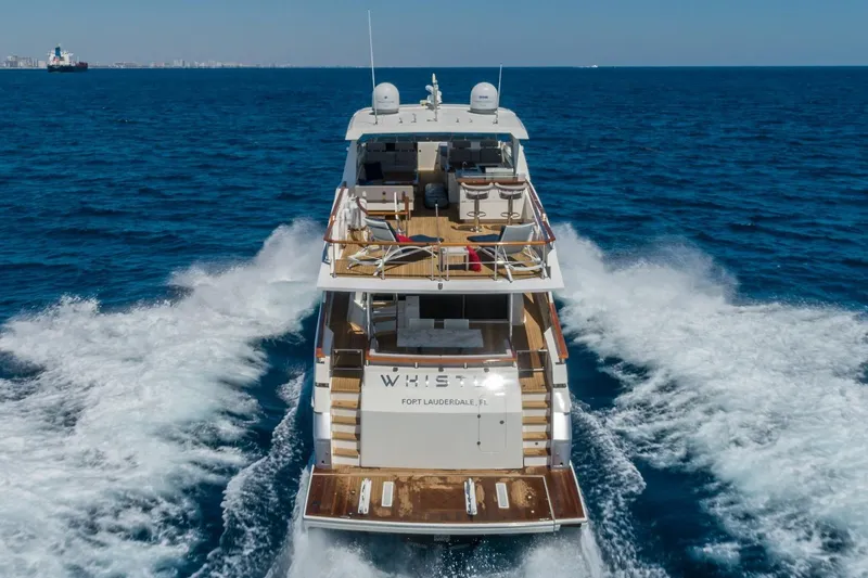 Slide: The Image of Luxury 2012 Lazzara Breeze yacht cruising on open sea, rear view. - 54