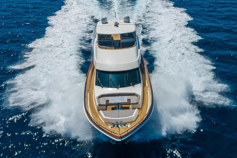 Slide: The Image of Luxury 2012 Lazzara Breeze yacht cruising on open blue sea. - 60