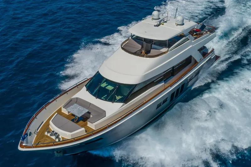 Slide: The Image of Luxurious 2012 Lazzara Breeze yacht cruising on open blue waters. - 62