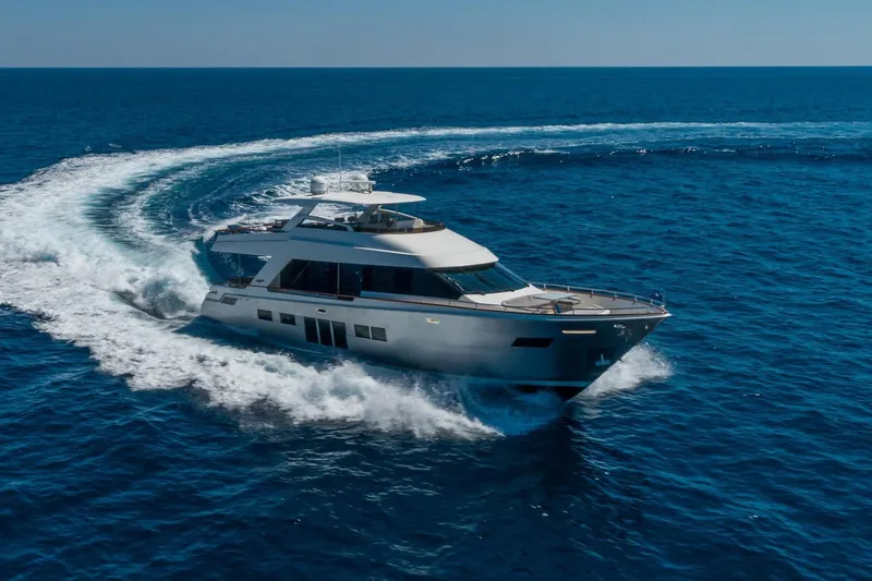 Slide: The Image of Luxury 2012 Lazzara Breeze yacht cruising on open blue sea. - 63