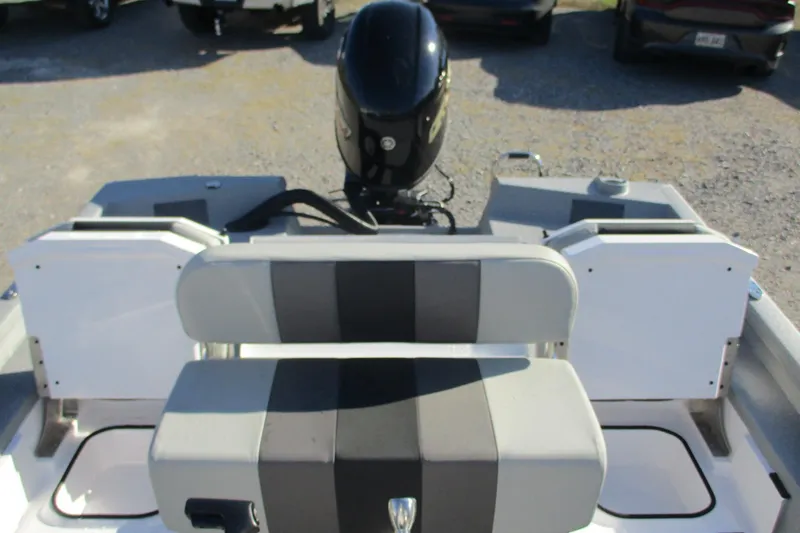 Slide: The Image of 2026 Vexus Defender 201 boat interior with seating and motor view. - 11