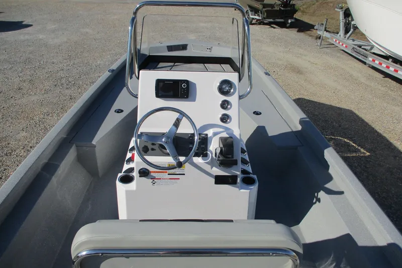 Slide: The Image of 2026 Vexus Defender 201 boat interior with steering console and navigation equipment. - 18