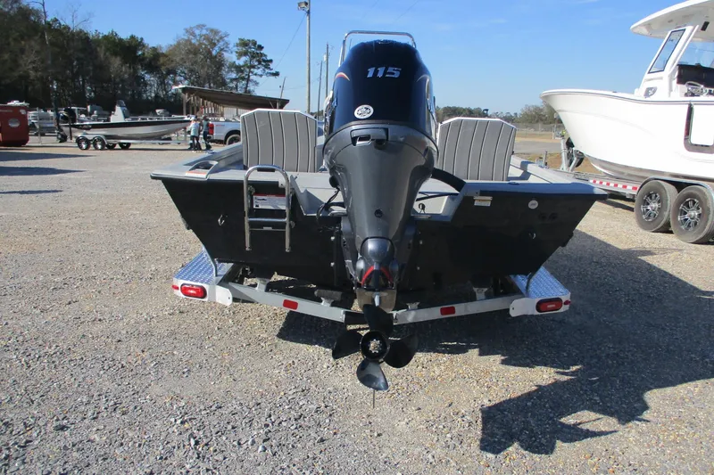 Slide: The Image of 2026 Vexus Defender 201 boat on trailer, rear view with outboard motor. - 3